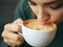 a person drinking coffee 