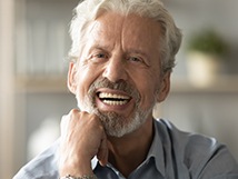 man smiling after getting all-on-4 implants in Springfield 