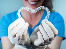 dentist making heart with clear aligners