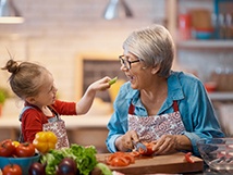 Woman eating with grandchild in Springfield