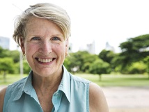 Older woman smiling outside