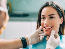 patient smiling while looking at dentist 