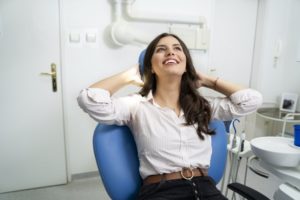 Woman smiling after visiting the cosmetic dentist