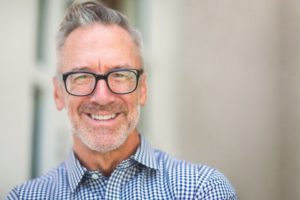 Man smiling after cosmetic dentistry 