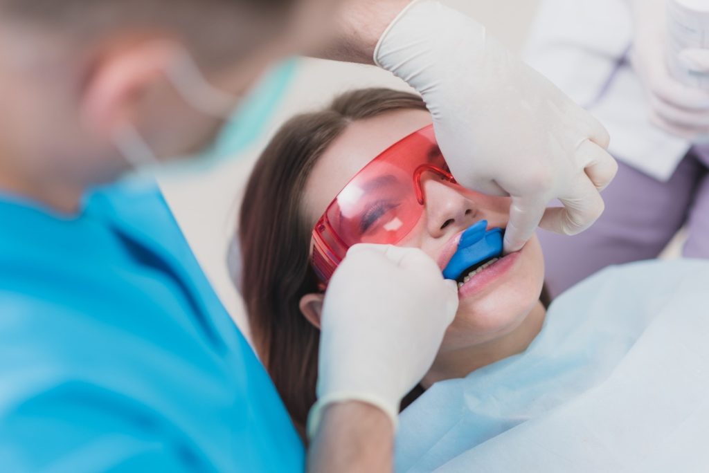 Young adult getting fluoride treatment