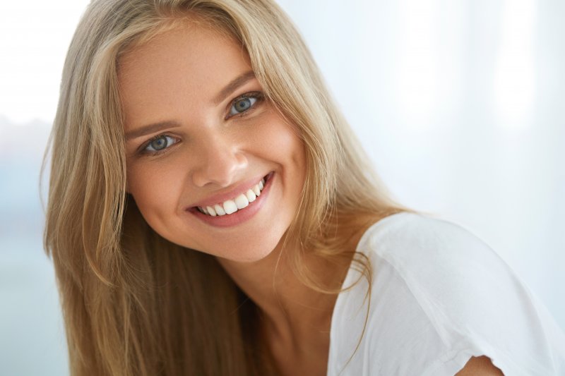 woman smiling after cosmetic dentistry 